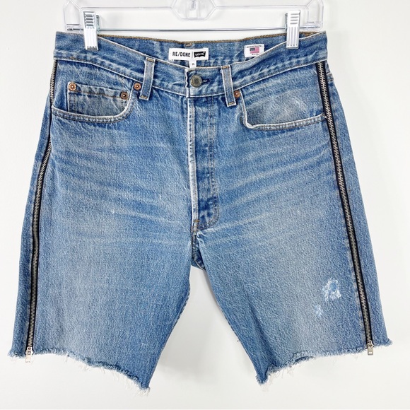 RE/DONE x Levi’s Side Zip 90s Distressed Denim Shorts...